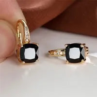 Square geometric ear hook studs with a round zircon stone, shown in a gold electroplated finish.