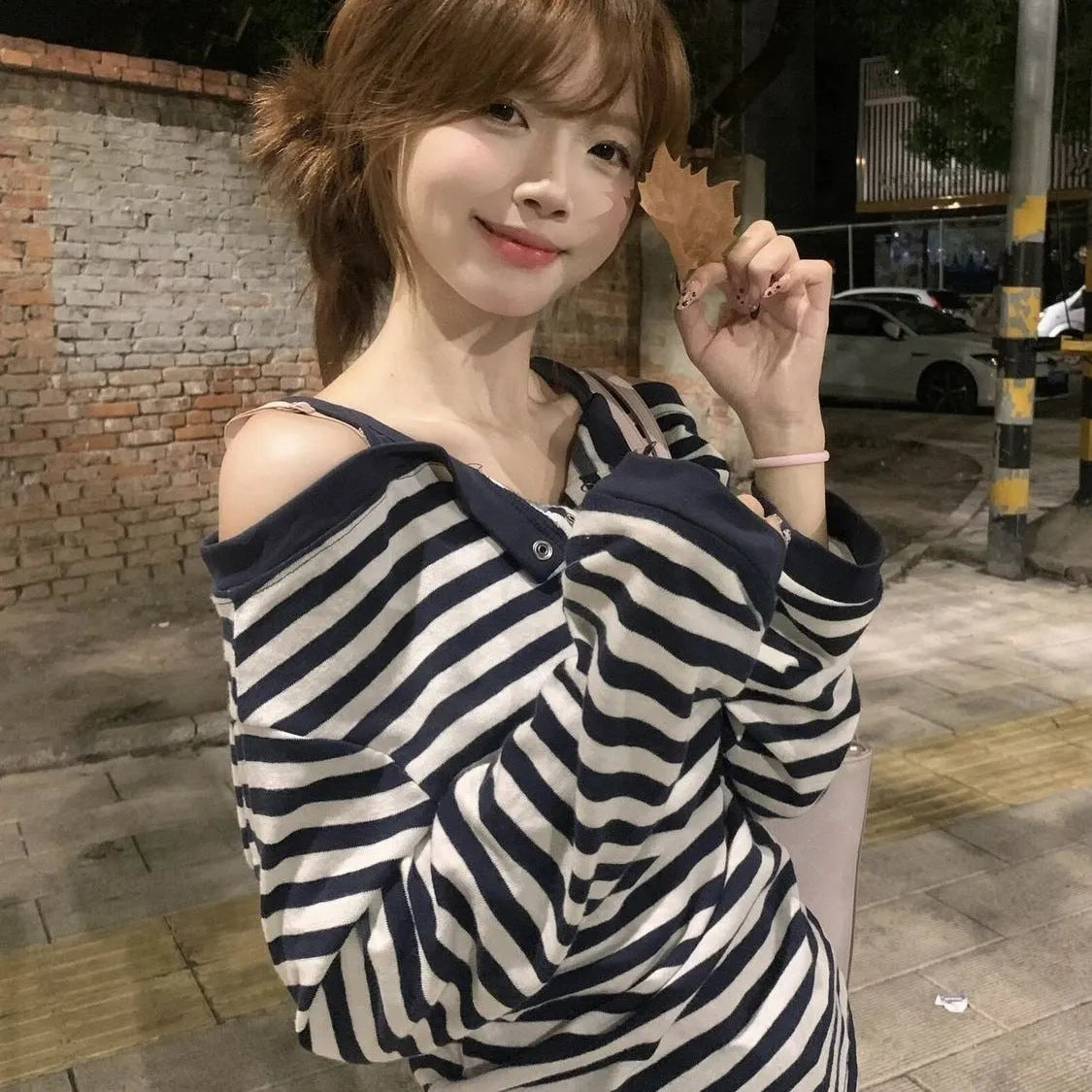 Dark blue oversized women's long sleeve t-shirt with embroidery and a striped pattern, Korean style.