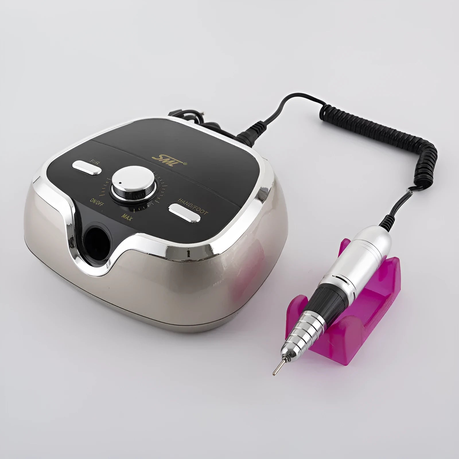 Nail polisher handpiece in golden finish with control buttons and power cord