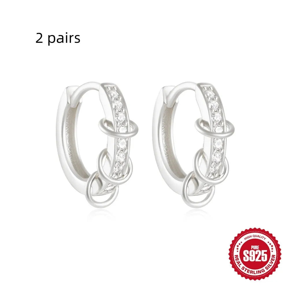 Small round geometric sterling silver stud earrings in gold and silver electroplated finishes.