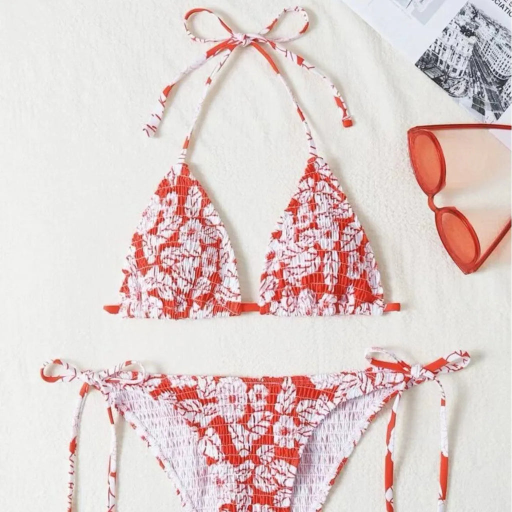 Women's floral patterned halter-neck bikini set in multiple colours on a mannequin