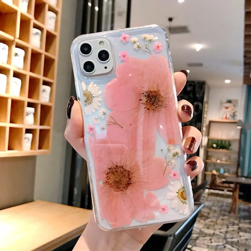 Pink and yellow floral pattern TPU back cover case for iPhone on a white background.