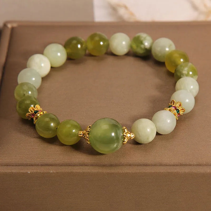 Women's green Xiuyan jade bracelet with an original sweet Mori style design.