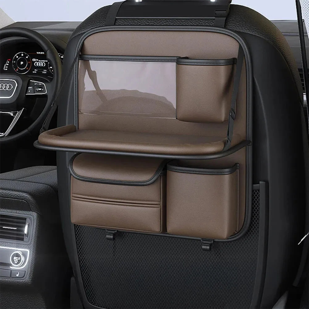 Car seat lazyback storage bag in Obsidian Black with foldable dining table extended, hanging on a car front seat backrest