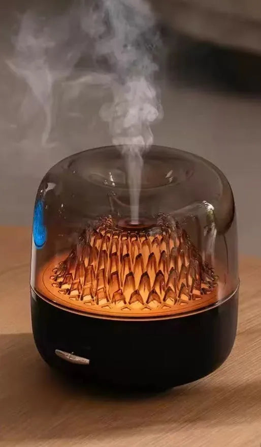 Round resin household aroma diffuser with colourful light on a desktop in beige colour
