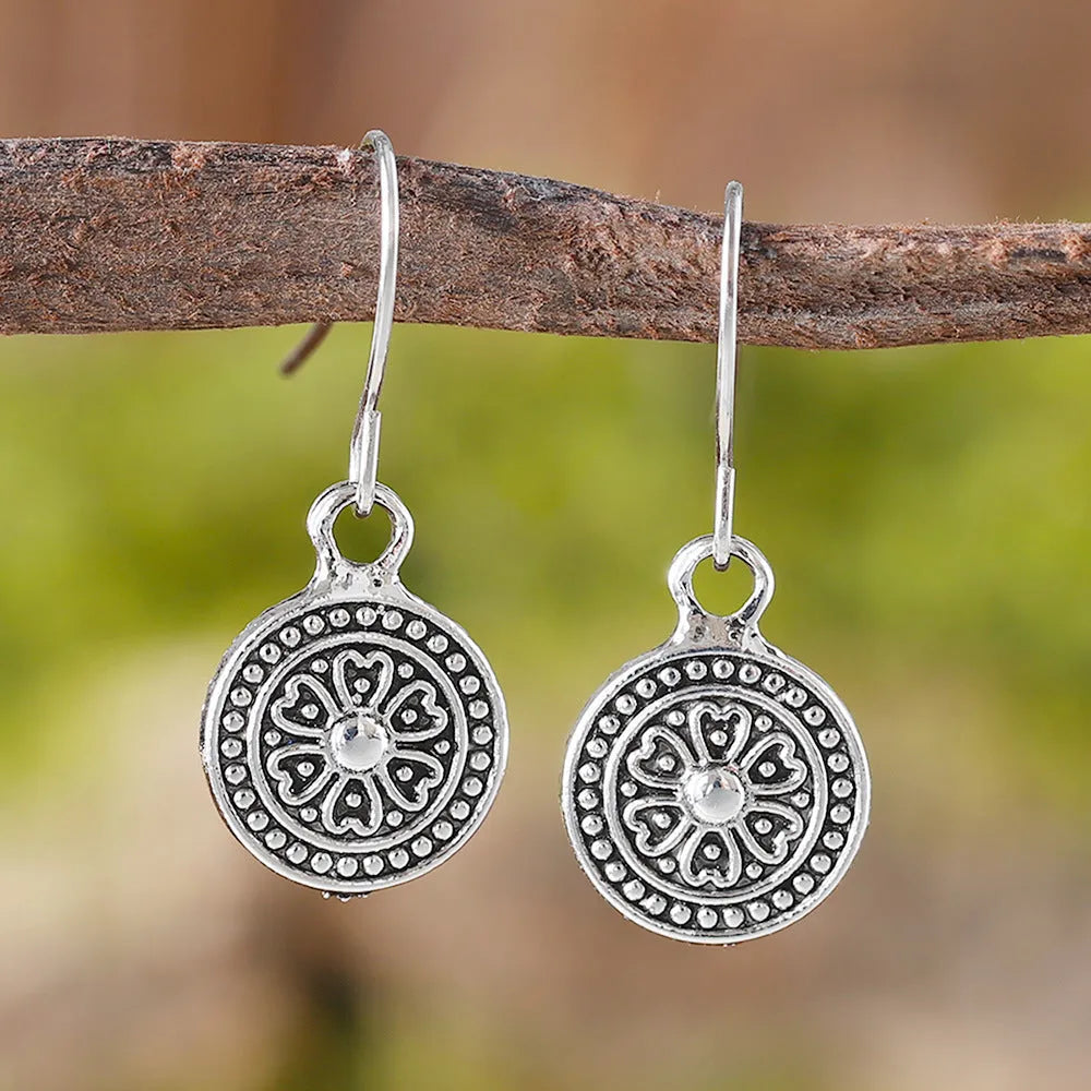 Geometric round women's earrings with distressed ethnic print in retro bohemian style.