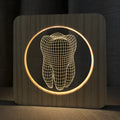 Tooth shaped wood coloured plastic USB night lamp on a surface