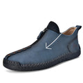 Men's black leather zip-up boots with round toe and hand-stitched rubber sole on a white background.