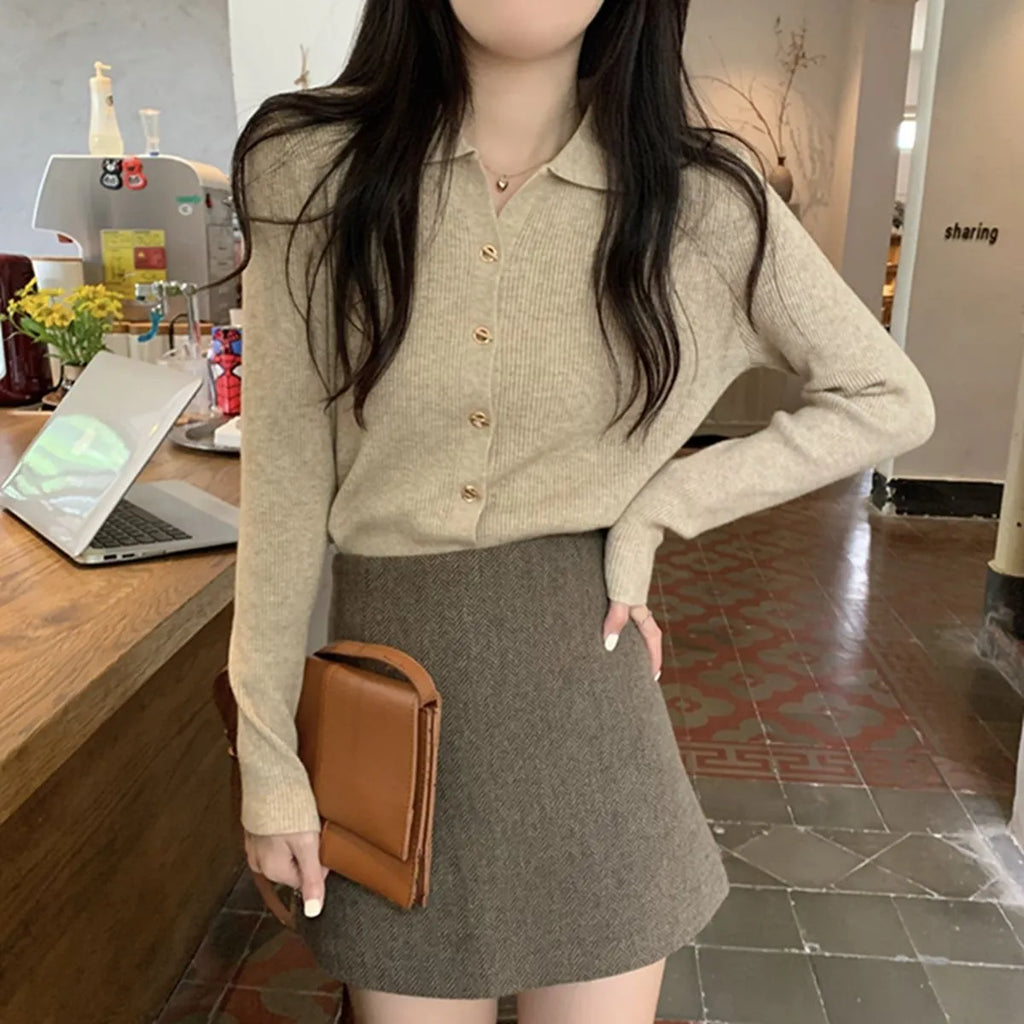 Women's beige loose-fit long-sleeved viscose knitted cardigan shown open as a layering piece.