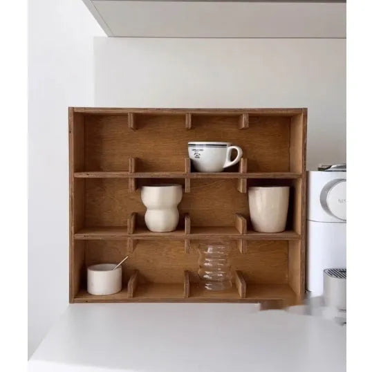 Square birch wood cup storage rack with multiple grid compartments for organising drinkware.