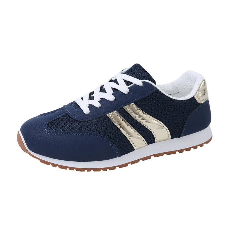 Blue women's casual sports shoes with cross shoulder straps and white rubber sole, shown on a size label.