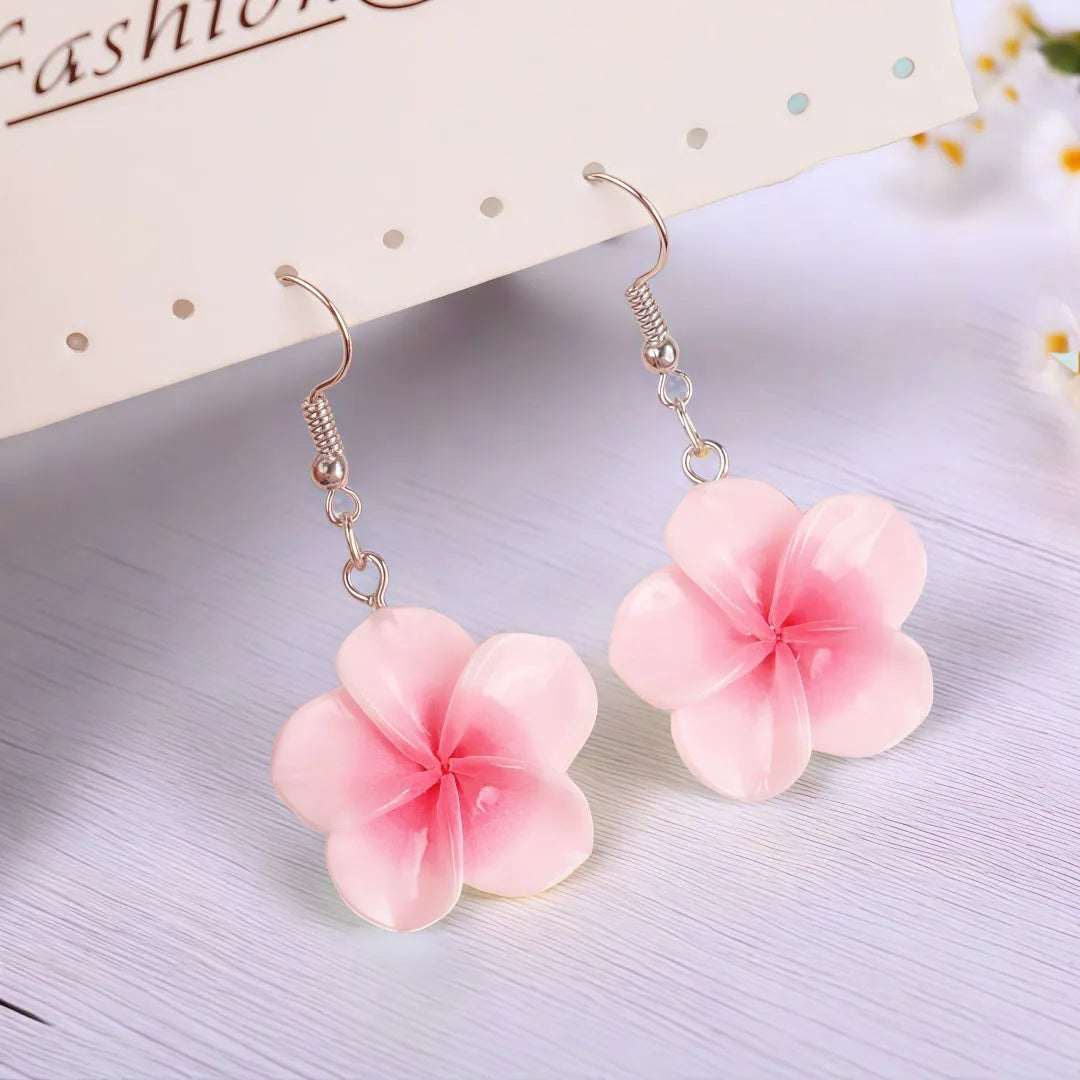 Handmade plastic resin earrings shaped like plumeria rubra flowers in a pair with multiple colour options