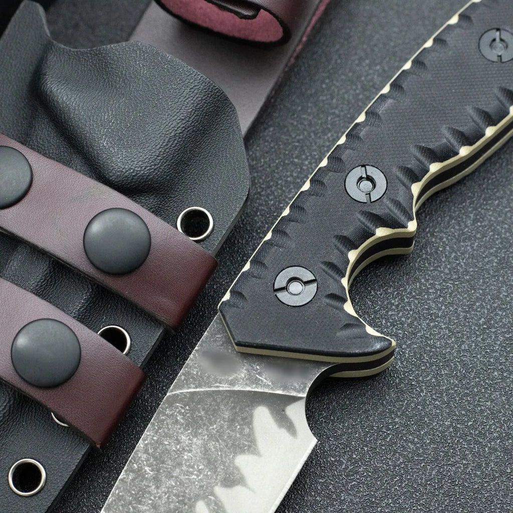 Portable camping knife with black handle and 100mm blade on plain background