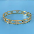 Gold or silver hollow women's bracelet with a four-leaf clover charm containing a white zircon stone.