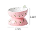 Ceramic raised cat bowl with tilted design in orange pattern, elevated 5 inches from base