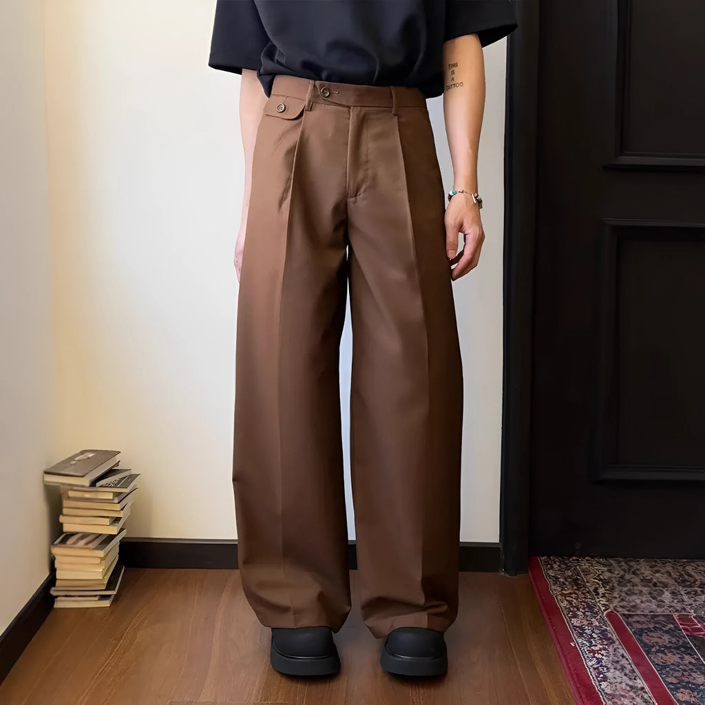 Men's straight-leg casual trousers in black with wide-leg draping silhouette on hanger