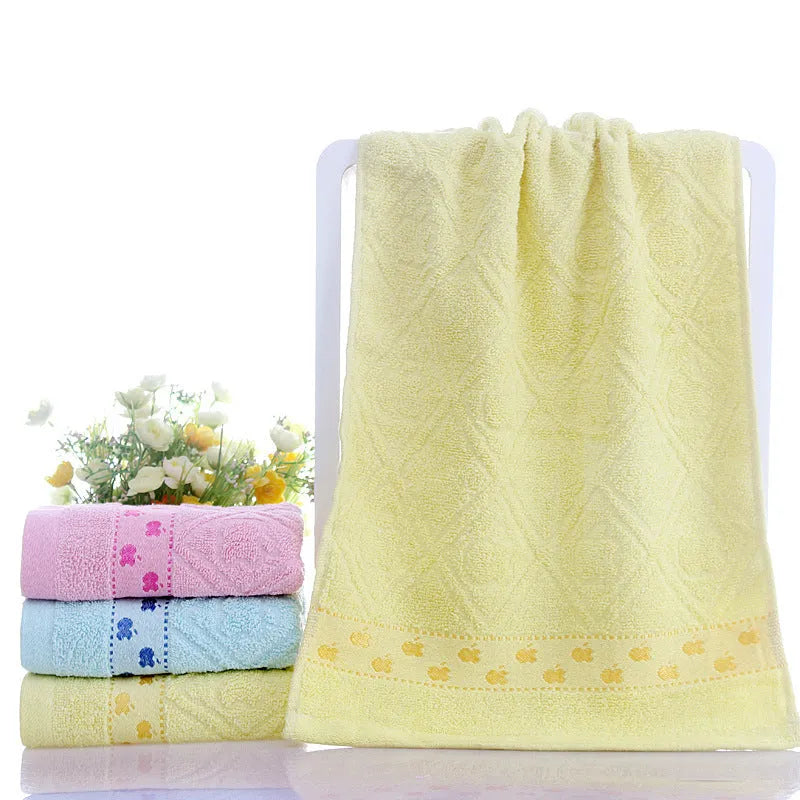 Cotton face towel 73x33cm in blue pink yellow patterns on hanger