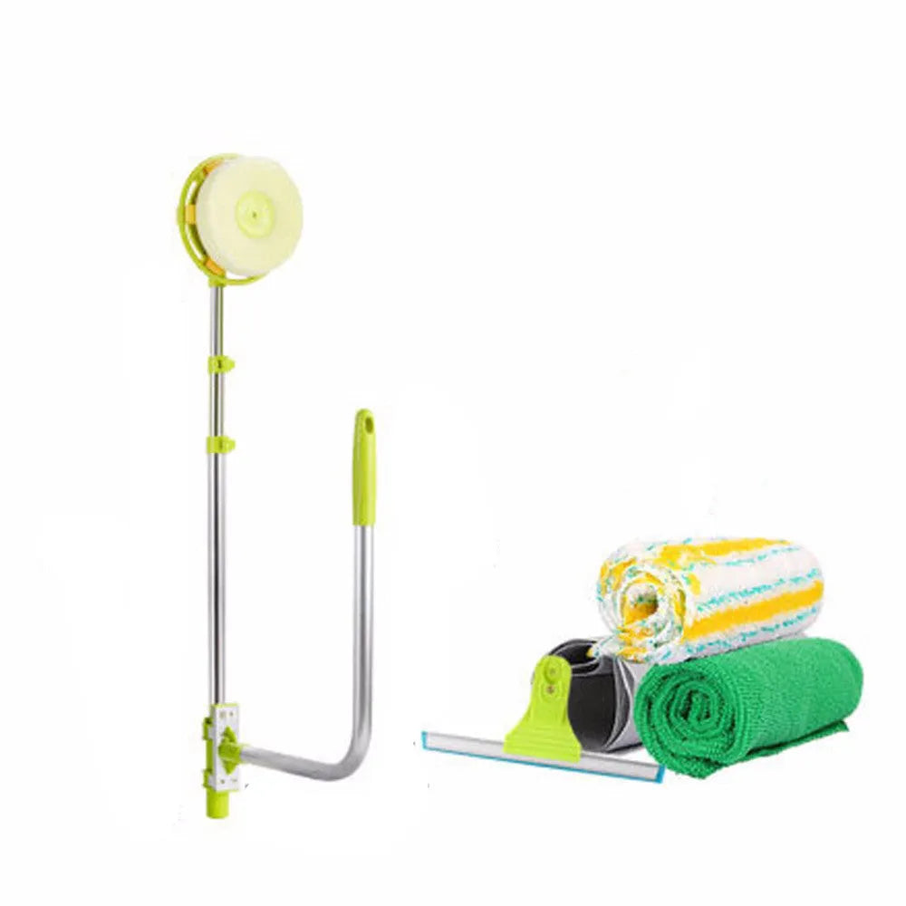 Green telescopic glass wiper with extendable handle resting on a windowsill