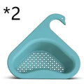 Yellow hanging swan drain basket made of plastic, fitted on a kitchen sink edge with space for vegetables and utensils