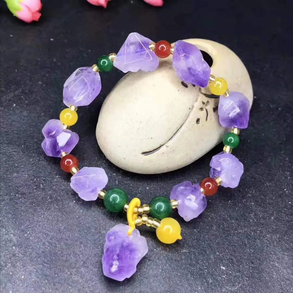 Women's amethyst bead bracelet with fu character charm and natural shaped beads