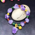 Women's amethyst bead bracelet with fu character charm and natural shaped beads