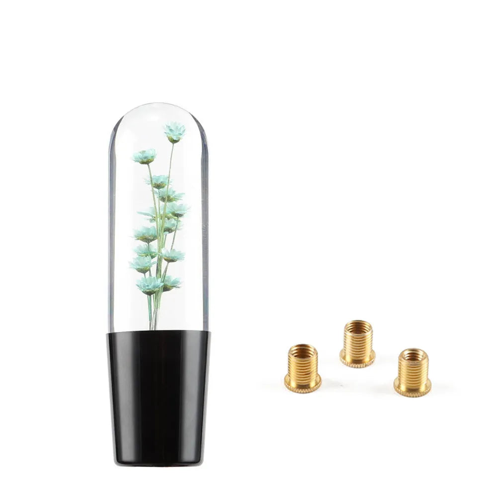 Transparent crystal car gear shift knob in assorted colours with three metal adapters.