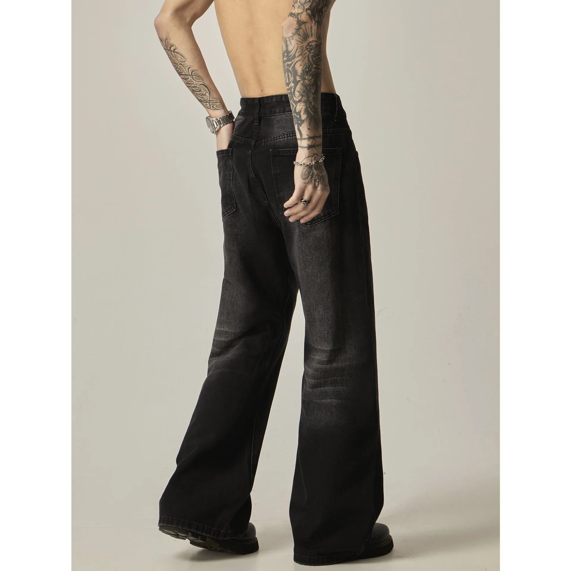 Black loose straight leg men's jeans with retro styling and zipper fly