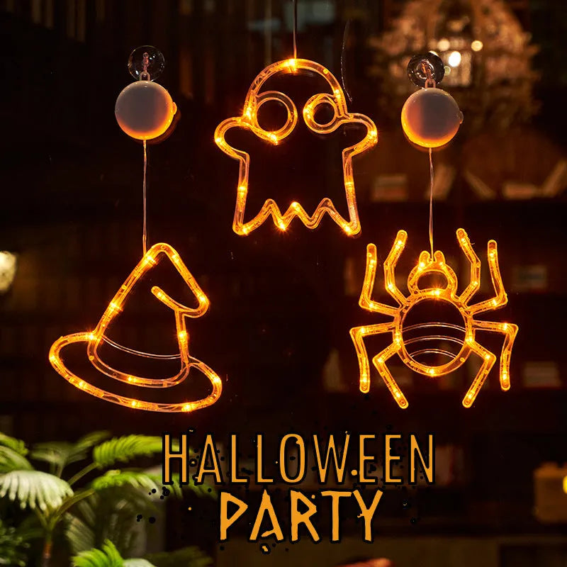Seven Halloween LED window lights with spider, pumpkin and ghost designs on suction cups