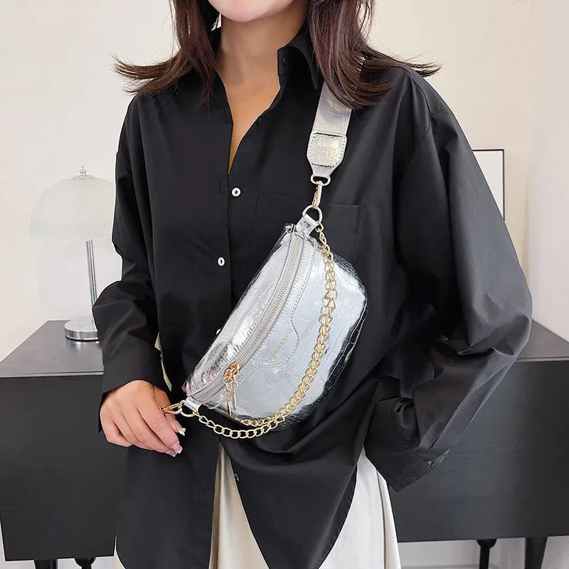 Shiny PU chest bag with chain shoulder strap available in silver colour
