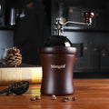 Solid wood barrel manual coffee grinder with hand crank in natural coffee colour