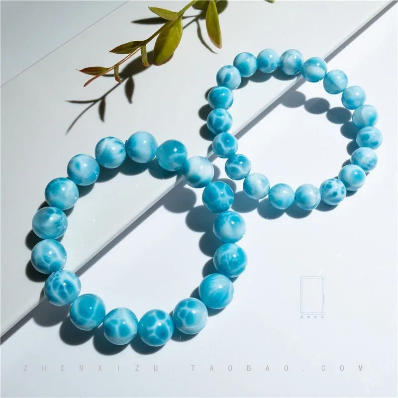 Blue handmade bodhi bracelet with natural crystal sea-pattern stone and pearl beads in Maillard style.