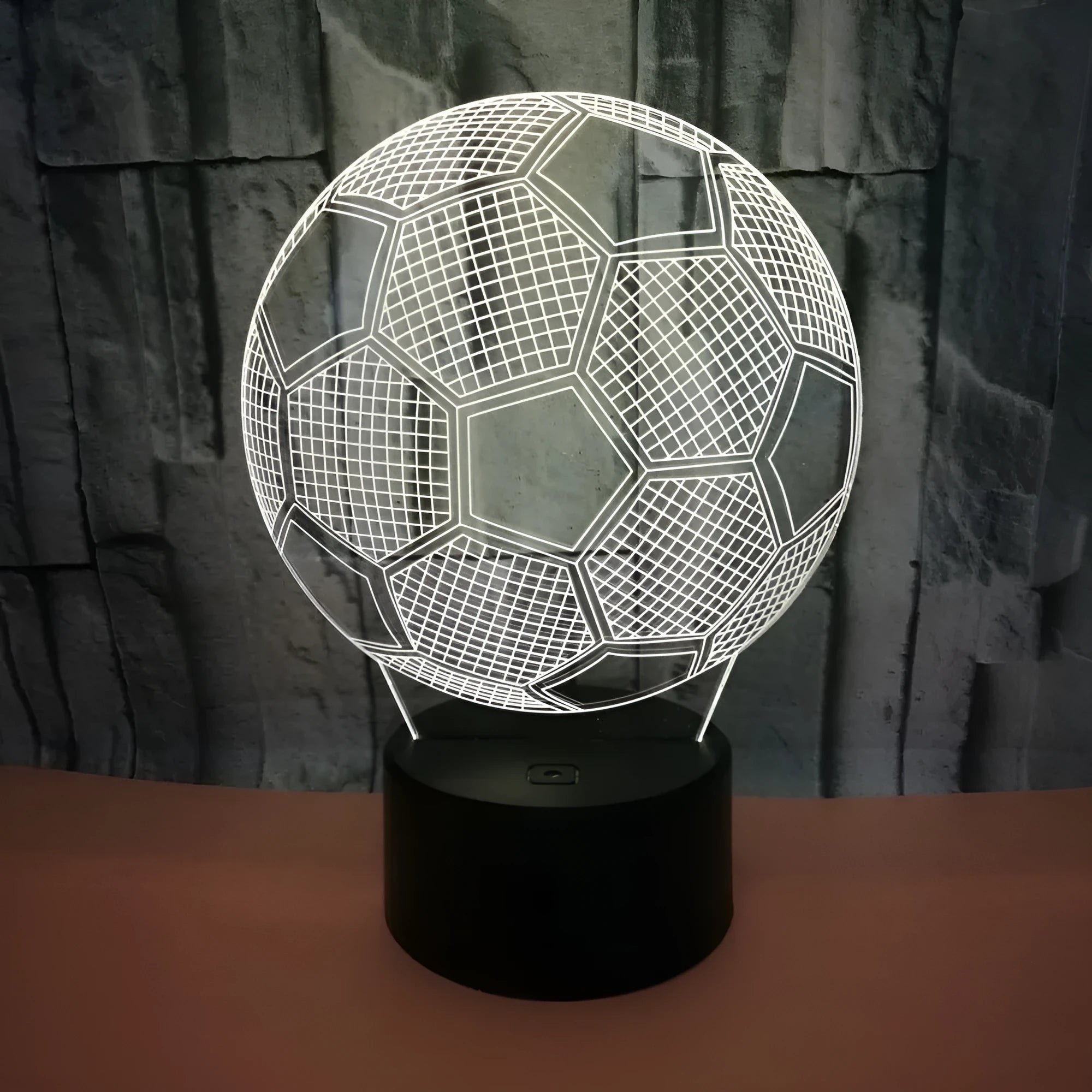 3D acrylic football night light displaying blue colour on a square black ABS base with USB cable.