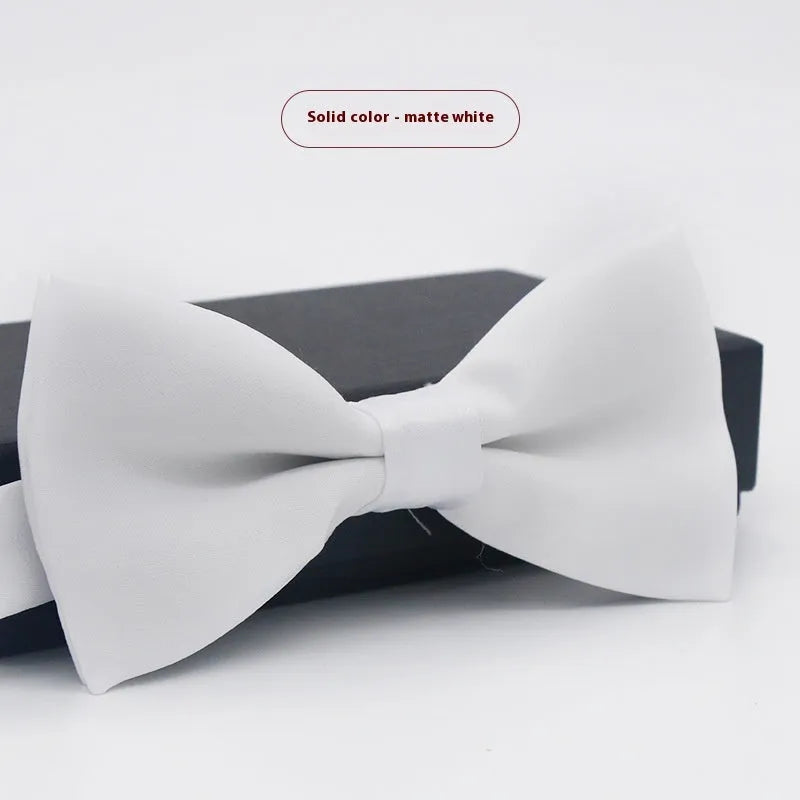 Solid colour polyester bow tie with flat head design measuring 12cm by 6cm