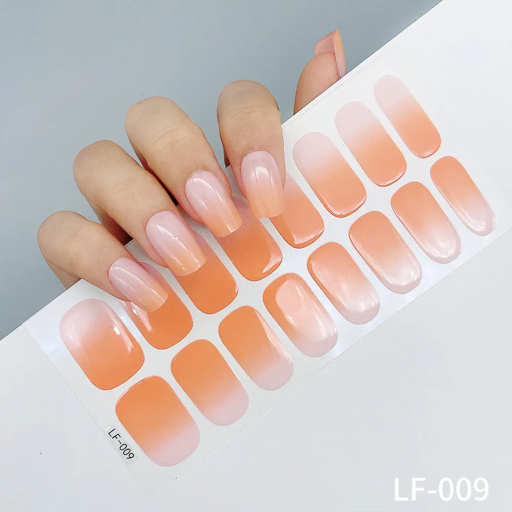 Set of 16 solid colour full nail art stickers showing patterns like cross, rose, tulip, and cartoon designs.