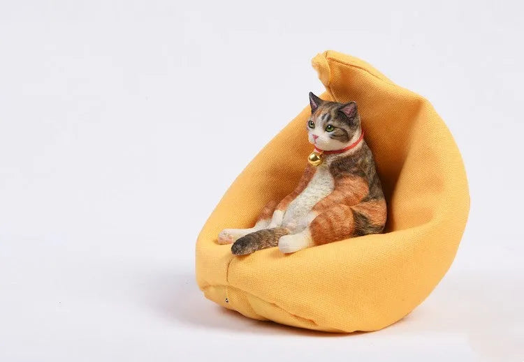 Small 7.5cm lazy cat ornament with sofa on car dashboard