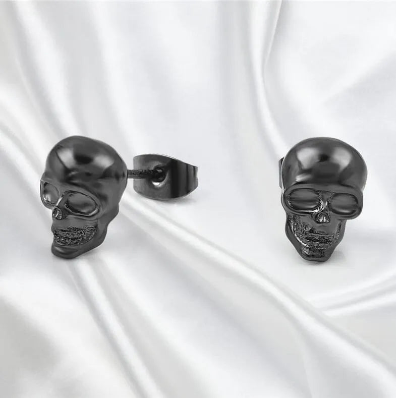 Small punk skull stud earrings in white copper with black colour, push-back closure
