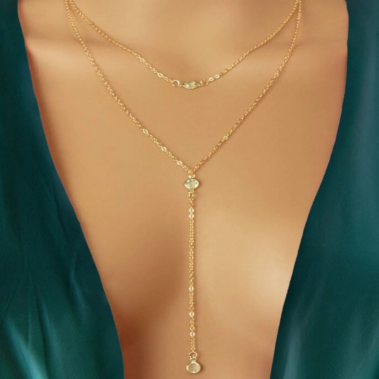 Alloy O-ring chain necklace with geometric pendant in gold finish on female neckline
