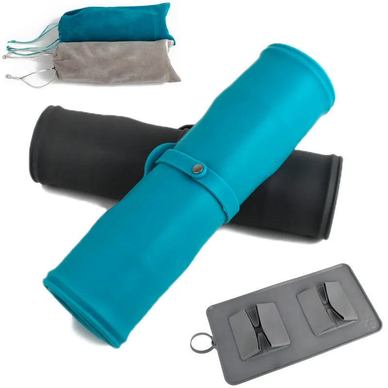 Collapsible silicone pet bowl in blue grey with velvet carry bag on a light background
