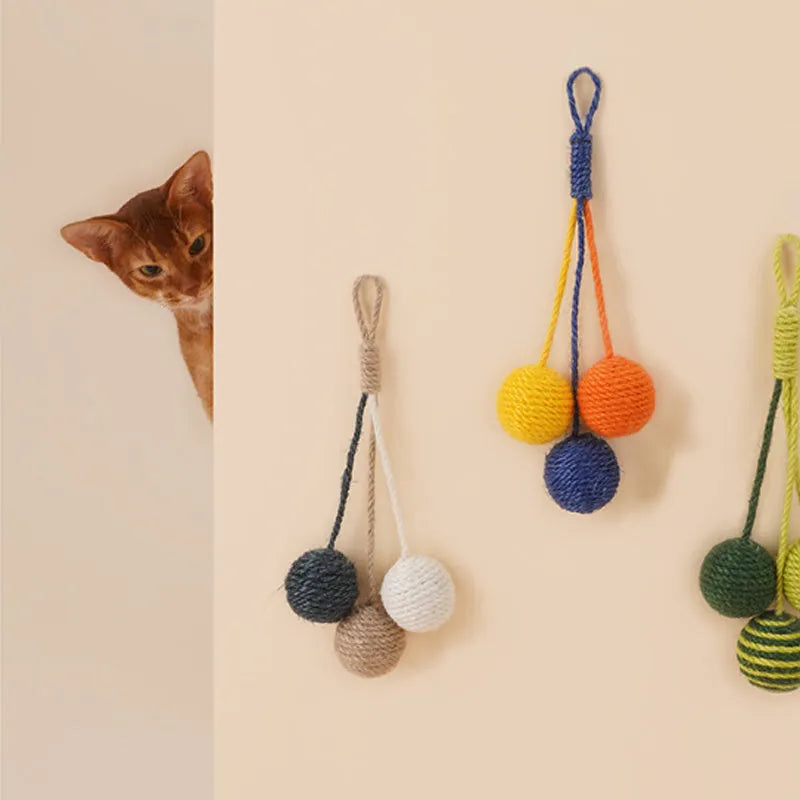 Cat toy set with teaser stick and coloured catnip balls on white background