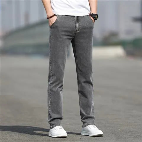 Men's smoky gray straight tube jeans with low waist and zipper fly closure