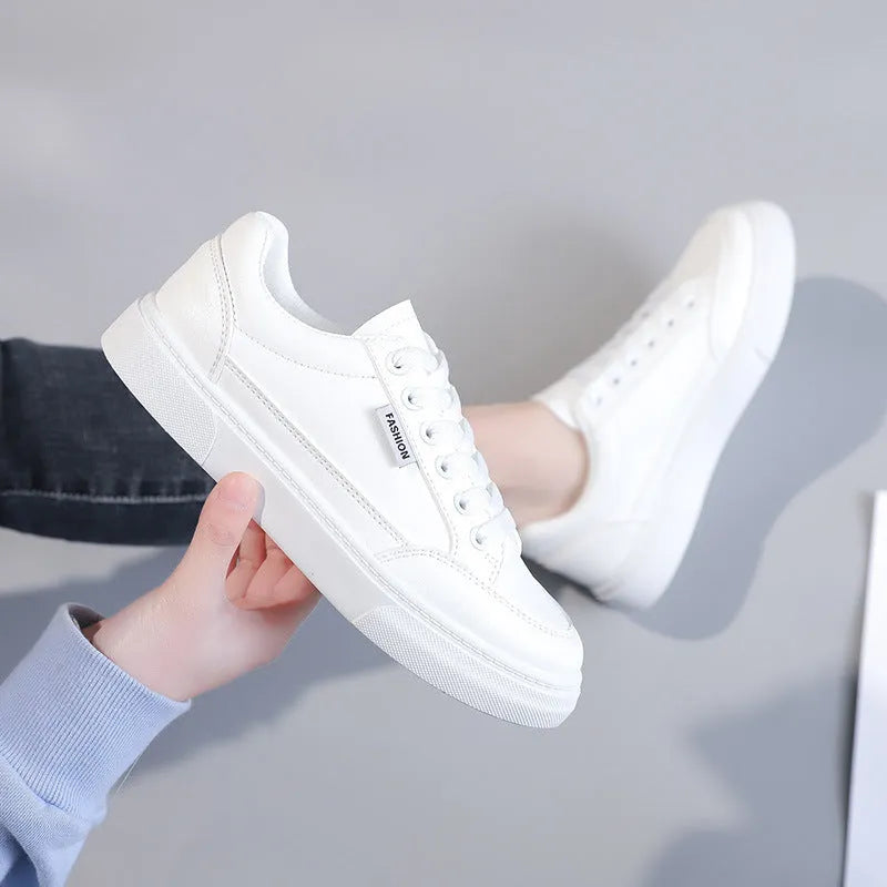 Women's low top sneakers in white or brown with artificial PU upper and plastic sole