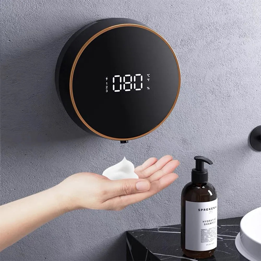 Black and white automatic foam soap dispenser with USB charging port mounted on wall