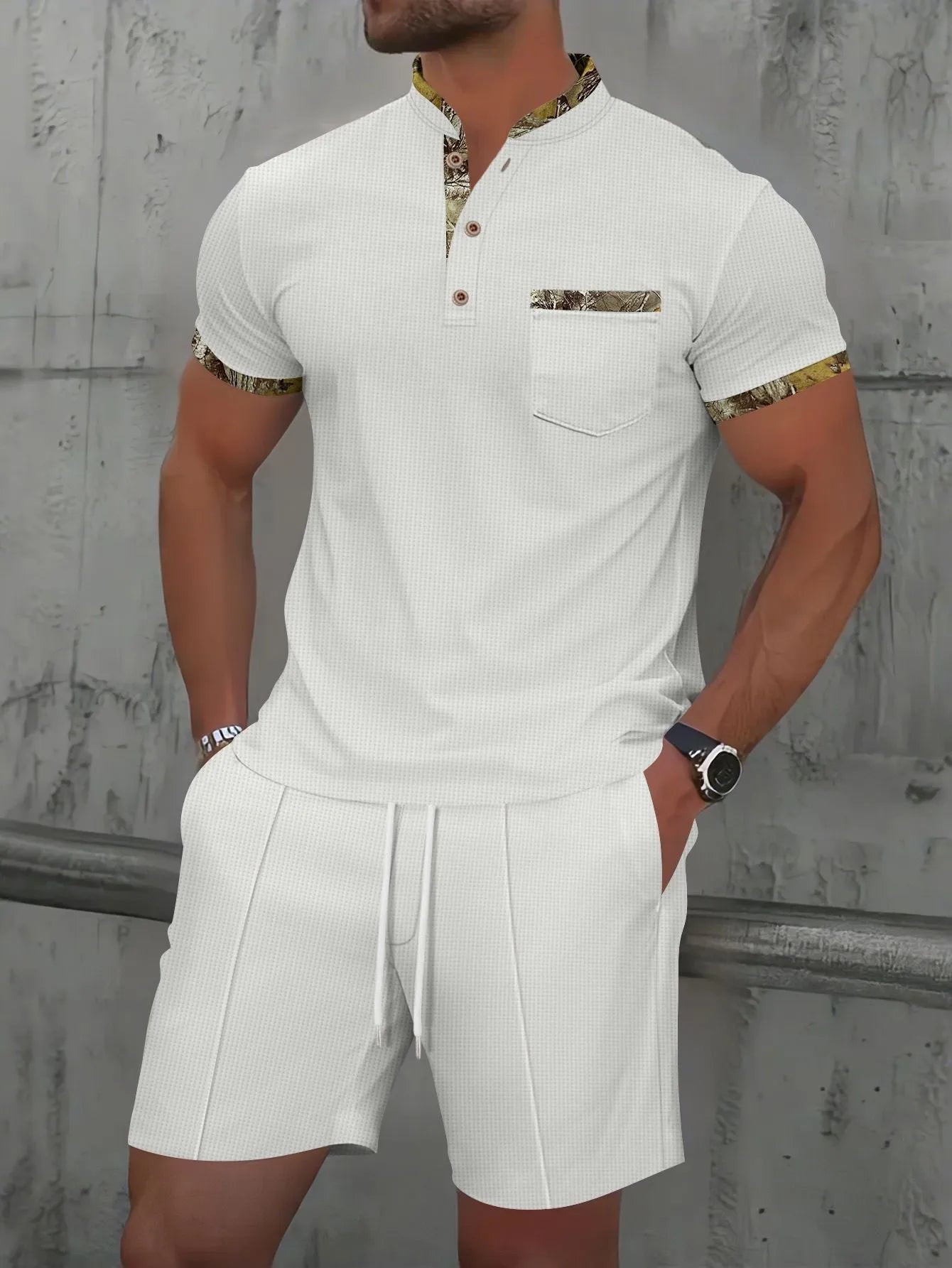 Men's grey waffle polo collar short sleeve suit top and shorts laid flat.