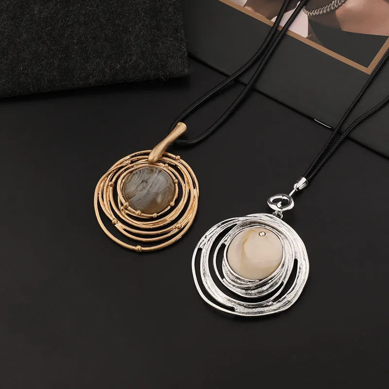 Gold tone geometric plaid pendant on a textured snakeskin wax rope chain necklace, adjustable from 51cm to 80cm.