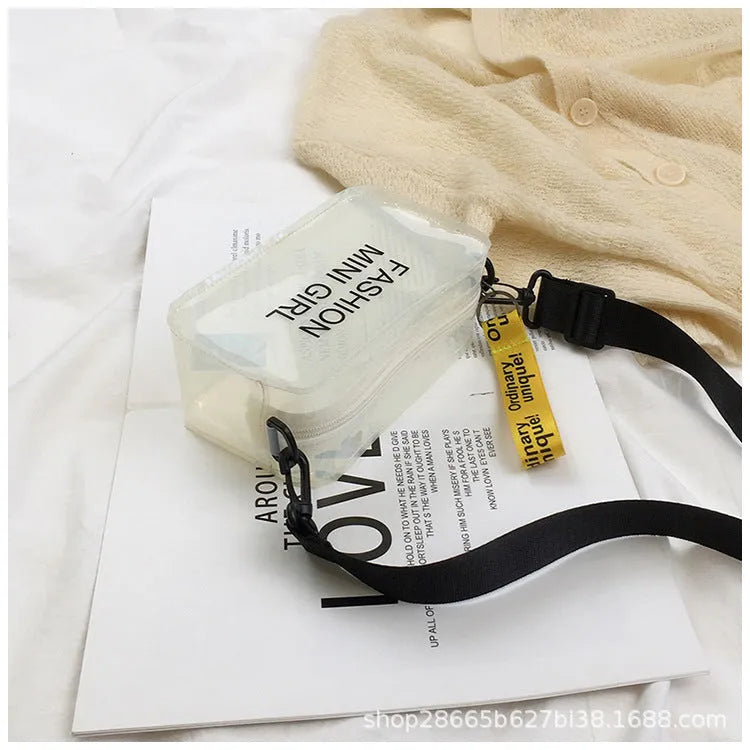 Clear square jelly shoulder bag with adjustable strap in various colours on a white background.