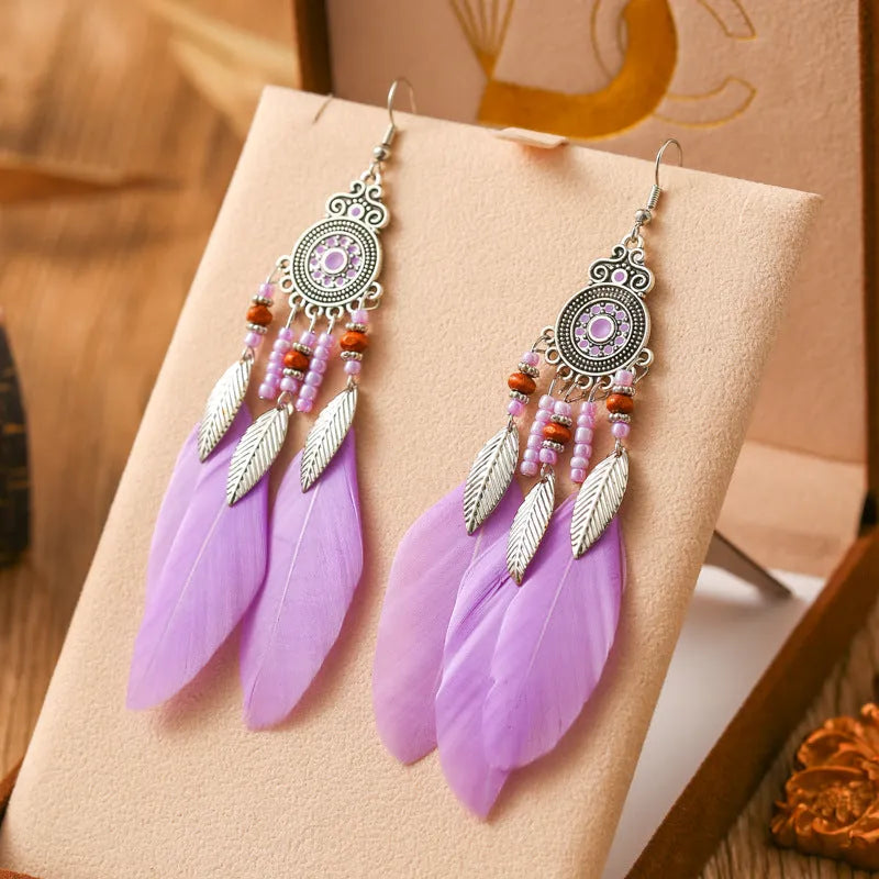 Round drop feather design alloy earrings with leaf pattern in a bohemian style, showing electroplated finish.