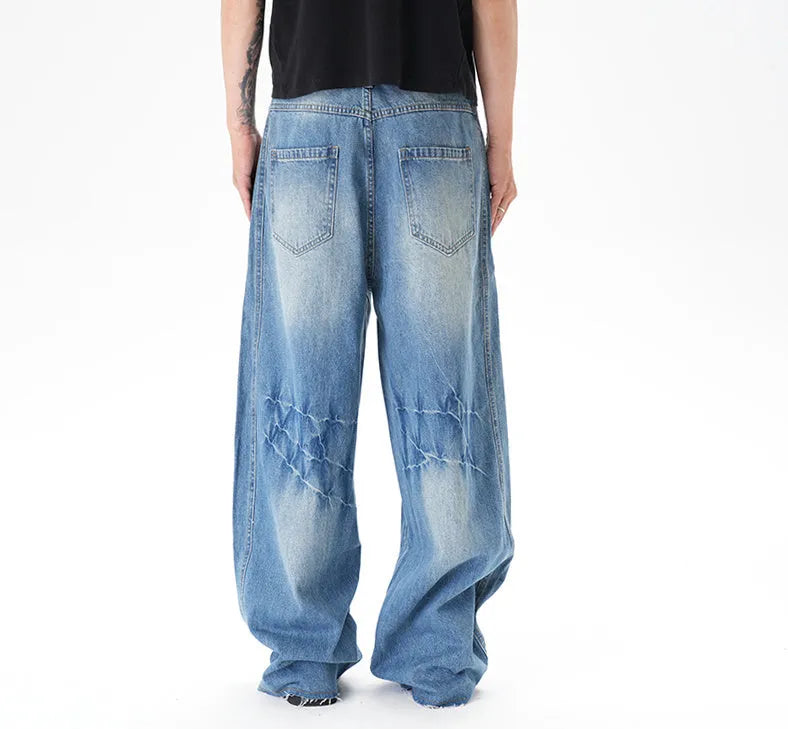 Light blue vintage washed wide leg machete jeans with zip fly closure on size chart