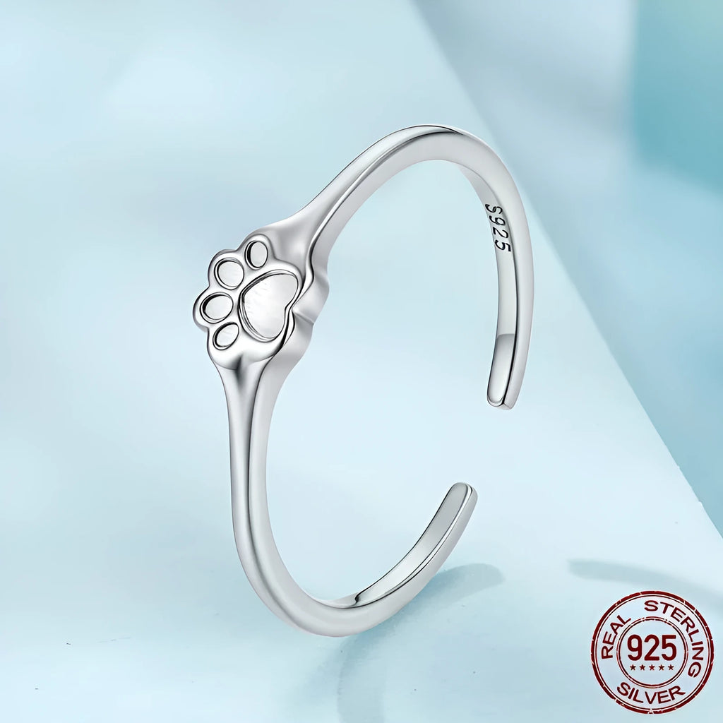 S925 sterling silver polished paw print open ring on woman's finger, adjustable size