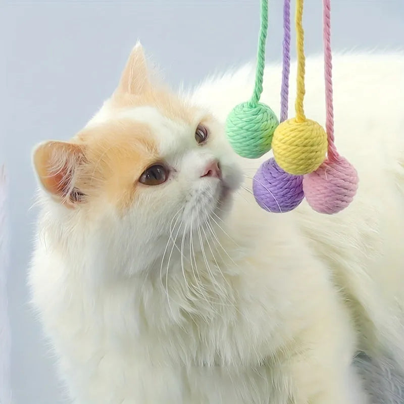 Colourful cat toy ball with rope and built-in bell available in green pink purple yellow for kittens