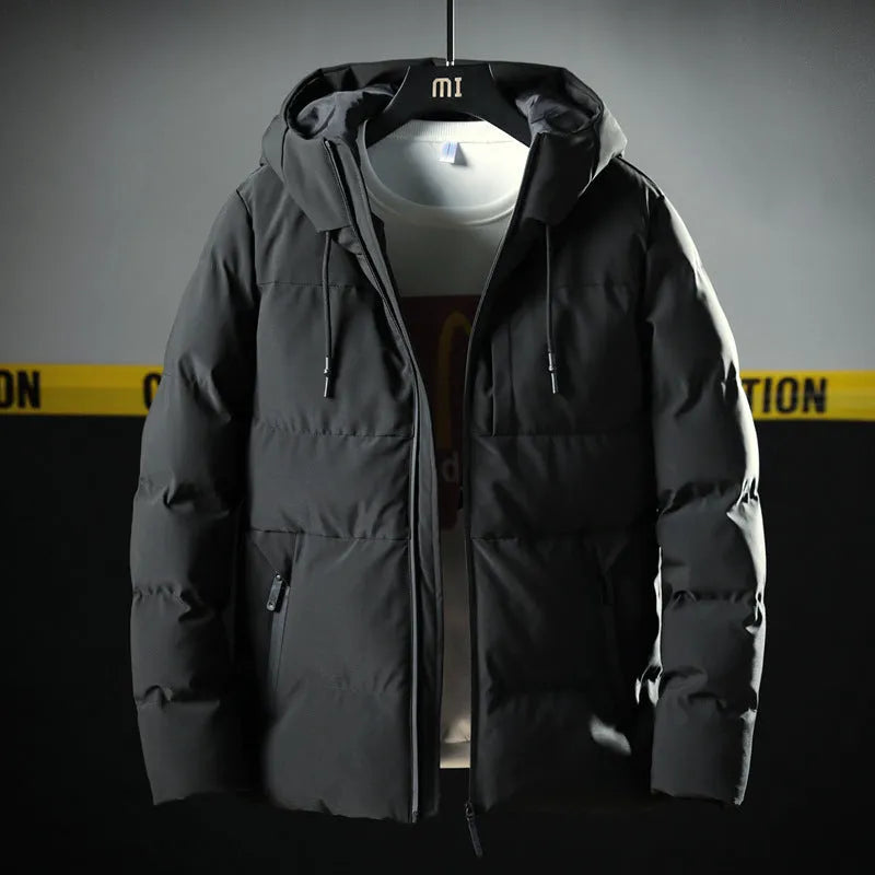 Men's hooded thick solid colour slim casual cotton coat with zipper, side pockets, and hood in black.